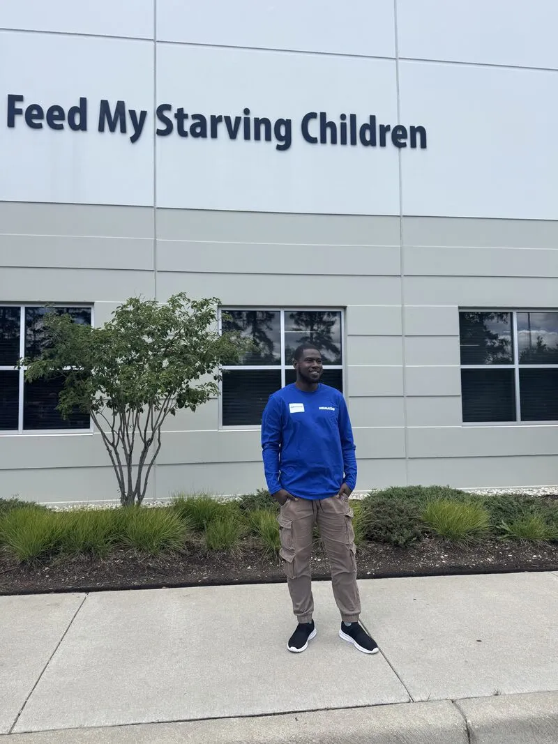 Jahmone outside the Feed My Starving Children building