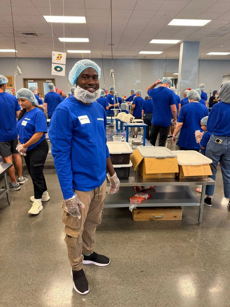 Jahmone in a hairnet at the meal-packing line